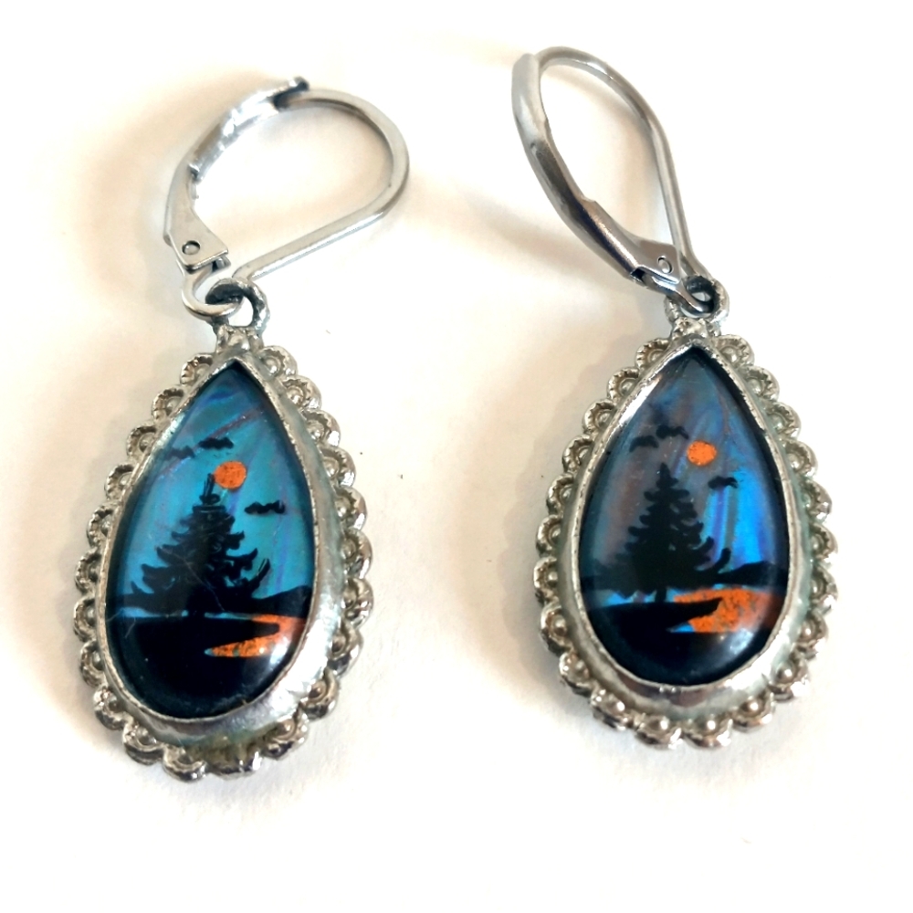Gorgeous vintage pierced earrings with a beautiful scene of an evergreen tree.